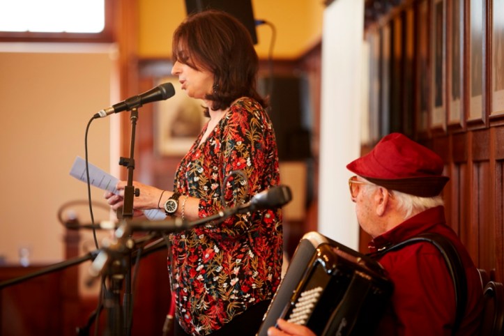 Lucia Nardo reading, her father Salvatore playing.